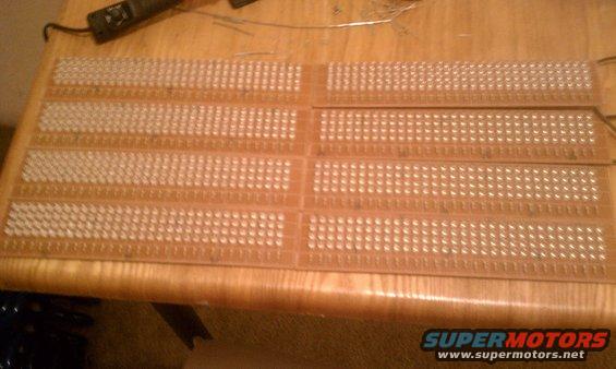 Circuit board with many small white LEDs laid out in rows