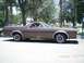 1979 Ford Ranchero - A brown 1979 Ford Ranchero is parked on a street with trees and buildings in the background. The date 7/30/2010 is visible.