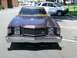 1979 Ford Ranchero - Front view of a brown 1977 Ford sedan with a prominent chrome grille and dual headlights.
