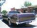 1979 Ford Ranchero - Rear view of a brown 1979 Ford Ranchero pickup truck parked outside a building.