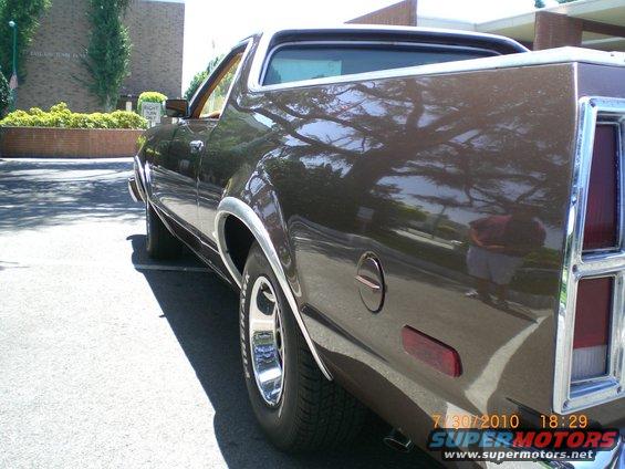 1979 Ford Ranchero rear quarter panel, brown paint, chrome trim, and side marker light