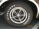 1979 Ford Ranchero - A close-up view of a tire and wheel assembly on a vehicle, with text and a date stamp visible.