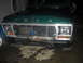 1993 Ford F-150 - Front view of a green 1993 Ford F-150 pickup truck a prominent chrome grille and Ford badging.