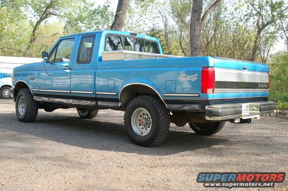 Blue 1992 Ford F-150 pickup truck parked outside