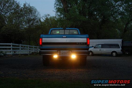 1992 Ford F-150 rear view with license plate AN30985 and two other vehicles parked nearby