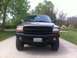 2001 Dodge Dakota - This pickup truck has a tan/brown exterior and a black grille. The license plate is visible.
