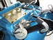 1978 Pontiac Trans Am - Close-up view of engine components, including a vacuum diaphragm and a metal bracket attached to the block.