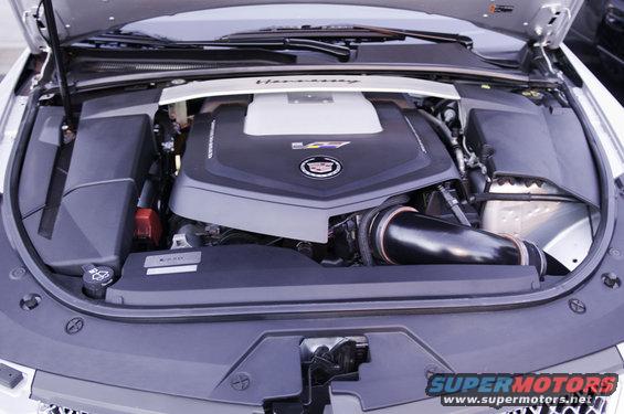 Cadillac V8 engine with 'Hennessey' strut bar and 'V8' badge on engine cover