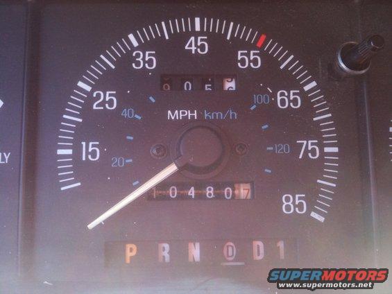 Speedometer and odometer in a vehicle, showing 4807 miles. Gear selector is in 'D'