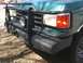 1989 Ford Bronco - This SUV features a heavy-duty bull bar and auxiliary lights, along with a '4x4' badge on the fender.