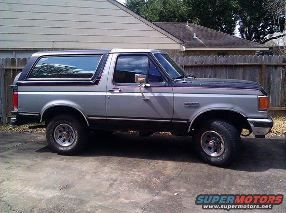 1989 Ford Bronco parked on concrete driveway
