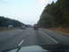 1989 Ford F-250 - View from inside a vehicle driving on a highway with other traffic and trees lining the road.