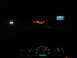 1989 Ford F-250 - View from inside a vehicle at night, showing dashboard instruments and distant traffic on a highway.