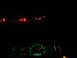 1989 Ford F-250 - Interior view of a 1989 Ford F-250 at night, showing illuminated gauges and other vehicles on the road.