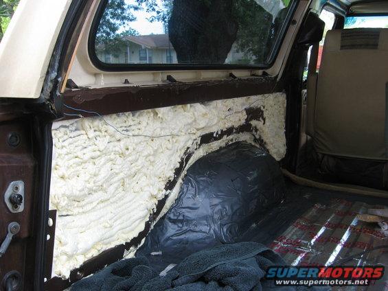 1979 Ford Bronco interior showing spray foam insulation and sound deadening material