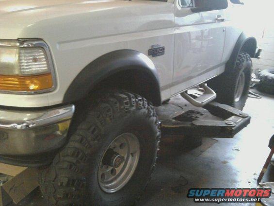 1996 Ford Bronco front fender, large off-road tire, and running board