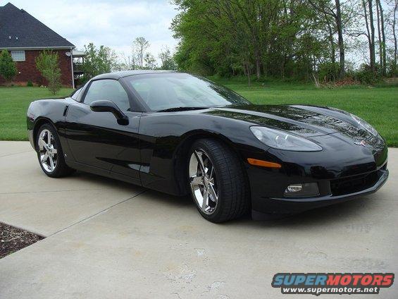 Black Chevrolet Corvette parked on a driveway