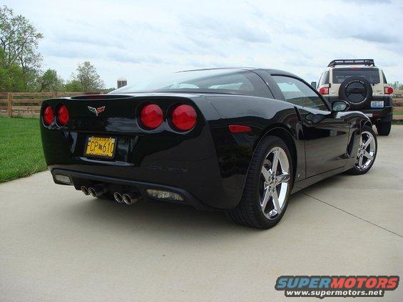 Black 2006 Chevrolet Corvette rear view with yellow license plate
