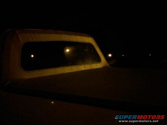 Soft top rear window of a vehicle at night