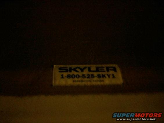 Yellow sticker with blue text reading "SKYLER 1-800-525-SKY1" and smaller text below