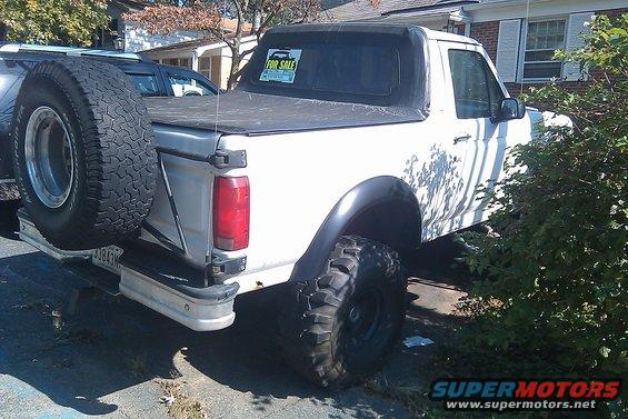 1996 Ford Bronco with soft top and spare tire mounted on rear bumper