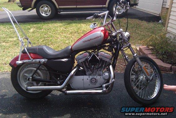 2004 Harley-Davidson Sportster Custom motorcycle, red and silver tank, chrome sissy bar