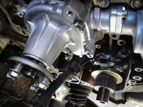 Engine part with bolts and a sensor