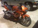 1998 Honda Interceptor VTR - Sport motorcycle parked outdoors next to a pickup truck.