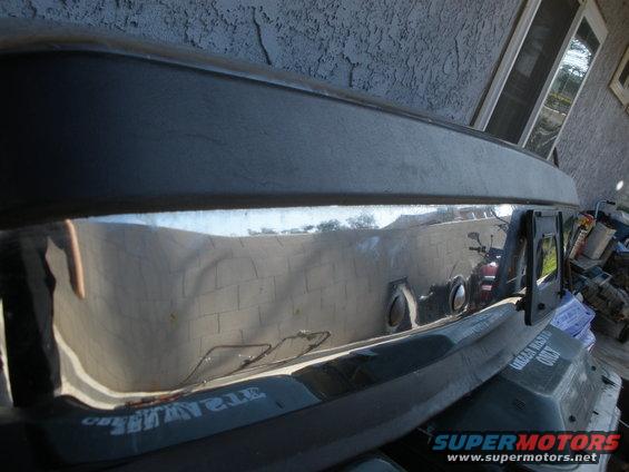 1989 Ford Bronco rear bumper and tailgate section with chrome trim and visible text