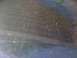 1985 Ford Mustang - Close-up of a dusty surface with a blue stripe, possibly a car's interior or exterior.