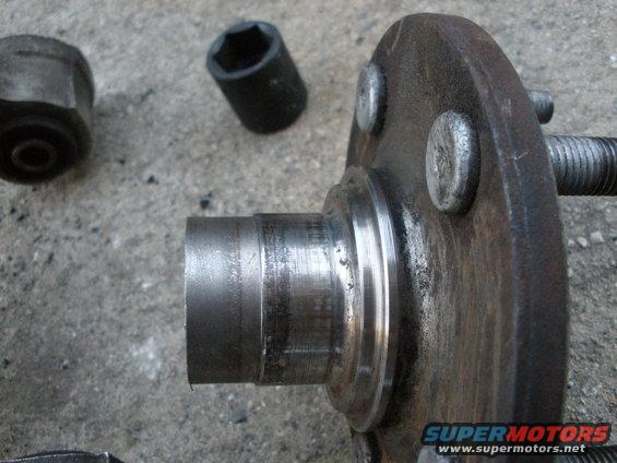 Wheel hub with lug nuts and socket on concrete