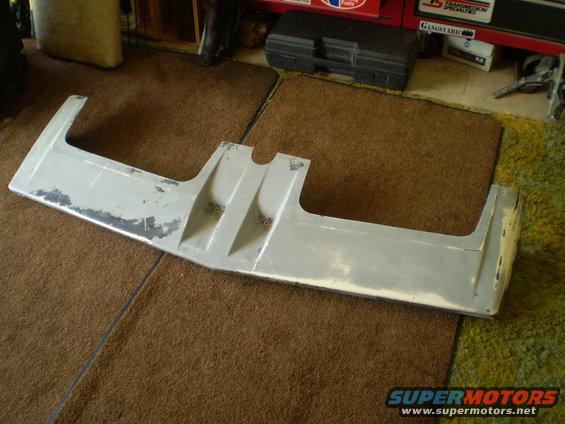 Gray front bumper spoiler with scuffed paint