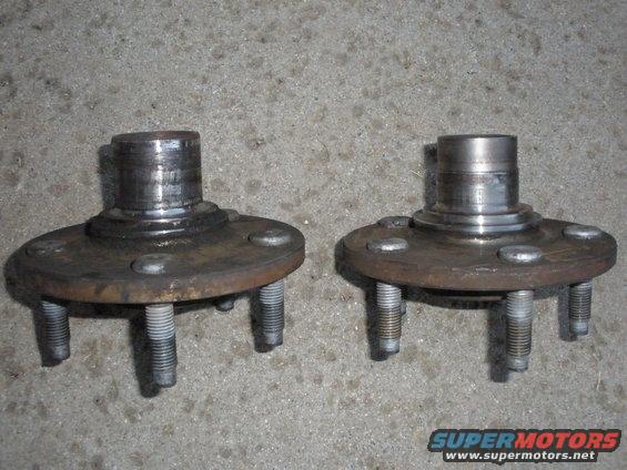 Two front wheel hubs with five lug bolts each
