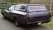 1972 Ford Ranchero - This 1972 Ford Ranchero features a camper shell and a rear view showing its distinctive body style and license plate.