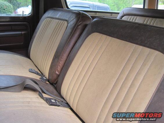 1979 Ford Bronco interior seats with brown and tan upholstery and seatbelts
