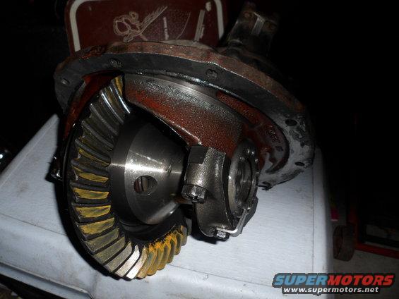 Differential housing with ring and pinion gears visible. Some yellowing on gear teeth