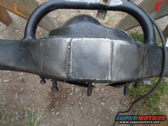 Rear axle differential housing with visible welds and mounting bolts