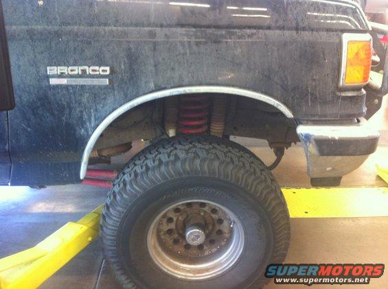 Black Ford Bronco side view showing lifted suspension and large tire