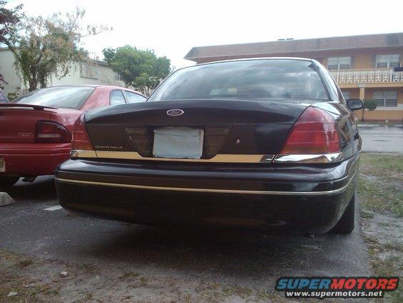 Black 2001 Ford Crown Victoria LX rear view with chrome trim