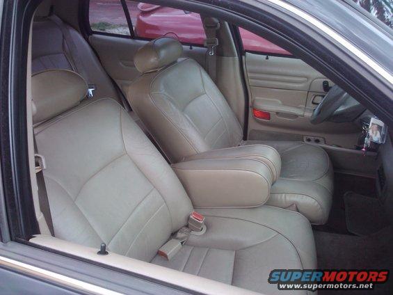 Interior shot of a 2001 Ford Crown Victoria showing tan leather seats and door panels