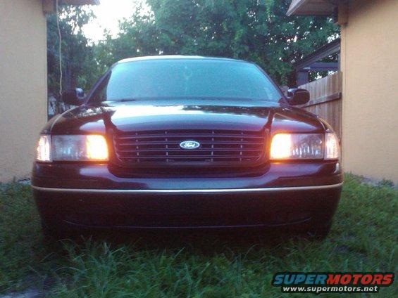 2001 Ford Crown Victoria front view with headlights on