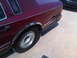 1993 Lincoln Town Car - Rear side view of a 1993 Lincoln Town Car with visible damage to the rear quarter panel.