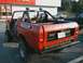 1978 International Scout II - Rear view of a red 1978 International Scout II with a roll cage and aftermarket bumper.