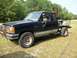 1994 Ford Explorer - This modified Ford Ranger pickup truck features a custom flatbed and a heavy-duty front bumper.
