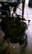 1994 Ford F-250 - Engine removed from a vehicle and suspended by an engine hoist.