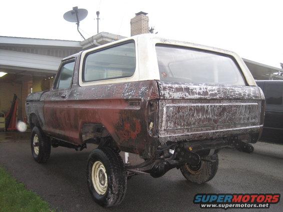 1979 Ford Bronco rear view, weathered red and white body