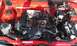 1991 Ford Festiva - The engine bay of a car is shown, various mechanical components and wiring.
