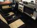 2010 Toyota FJ Cruiser - The interior of a Toyota FJ Cruiser is shown from the passenger side, highlighting the dashboard and seating.
