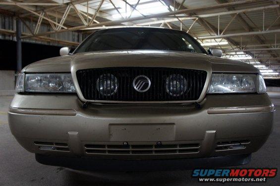 Gold 2000 Mercury Grand Marquis front grille and headlights