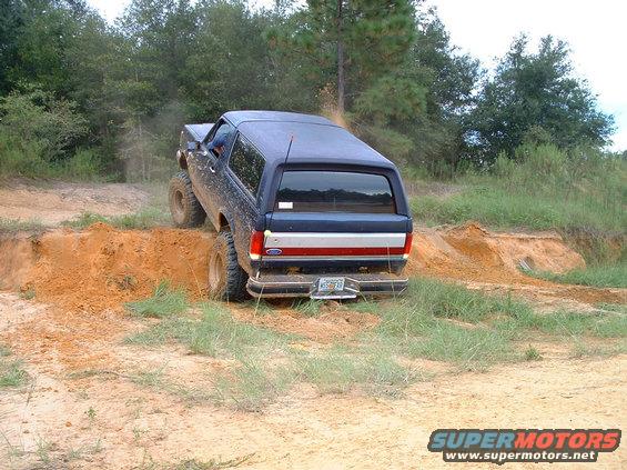 1995 Ford Bronco rear view climbing dirt hill